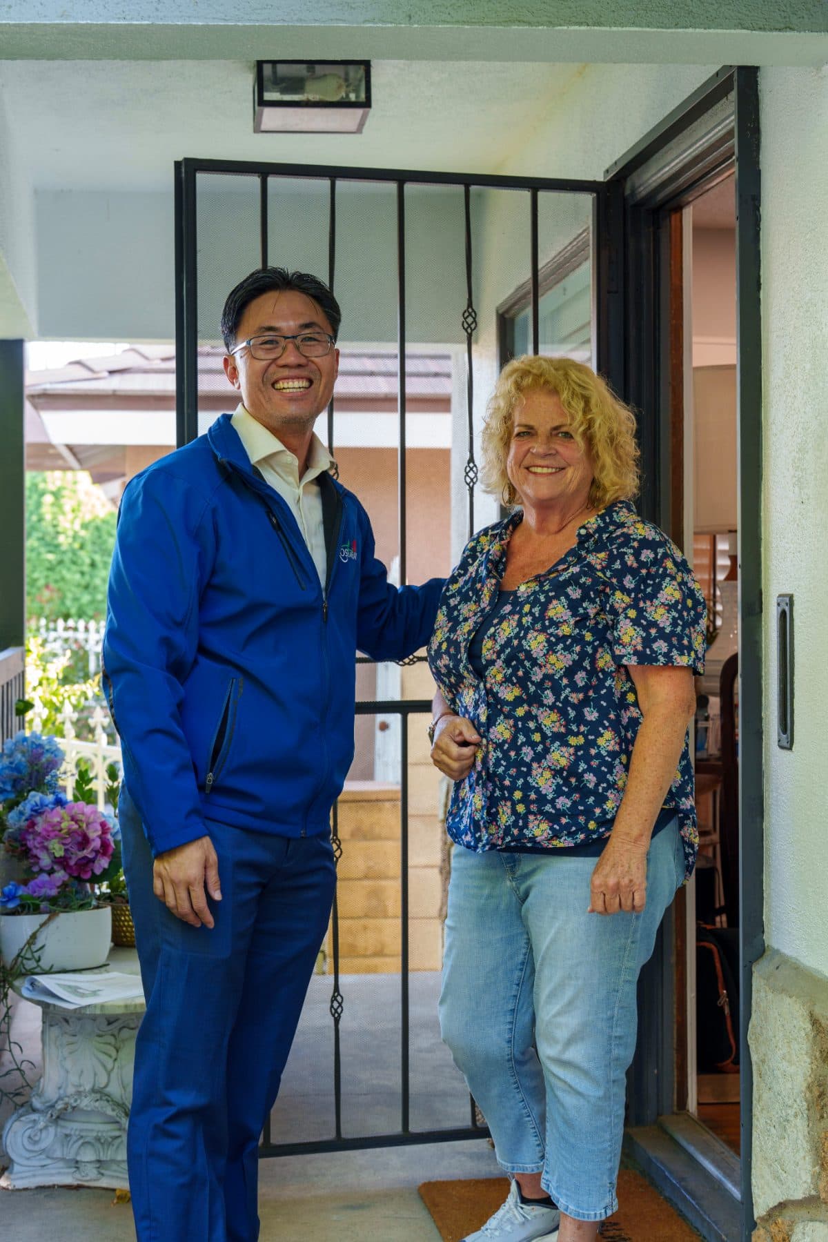 Steven Ly with a Rosemead resident at the front door