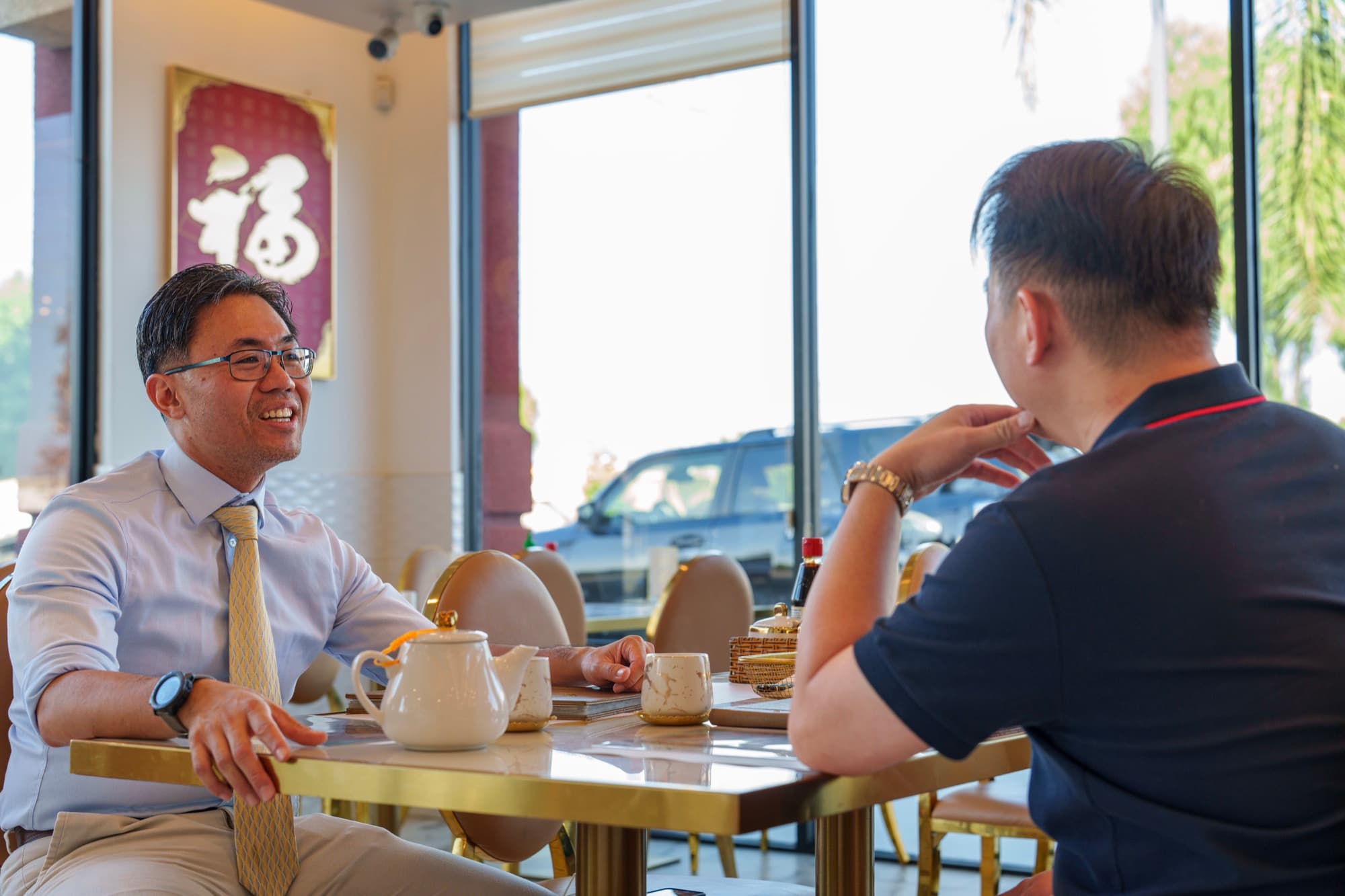 Steven Ly laughing during a visit to a Rosemead restaurant