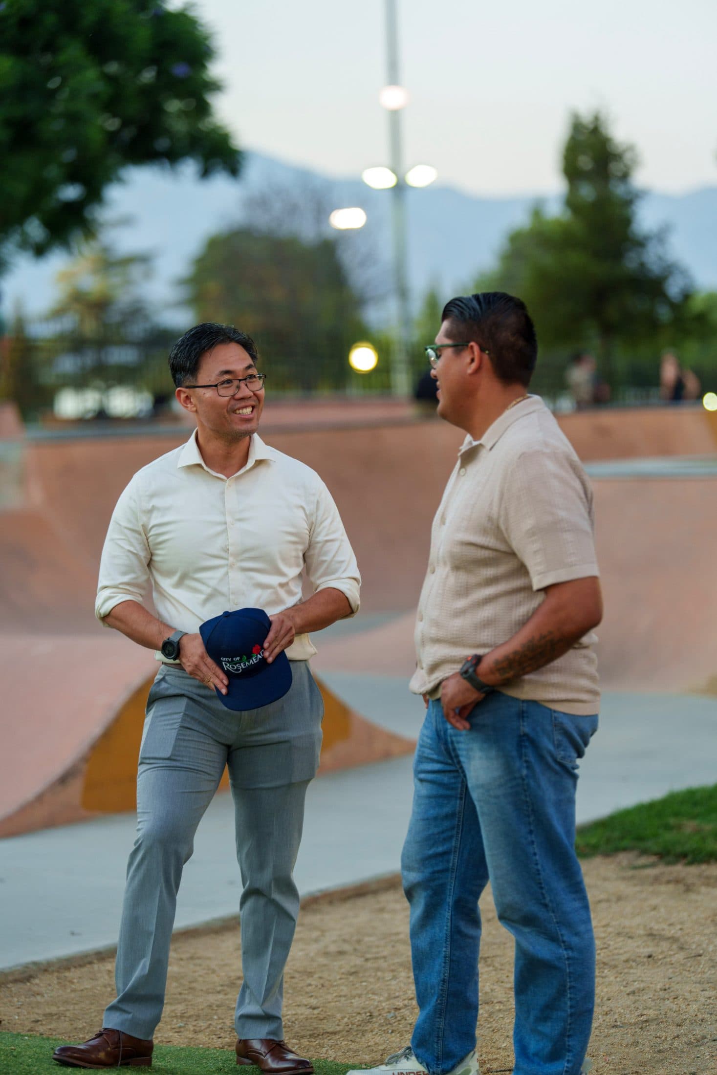 Steven Ly talking with a resident at the skate park