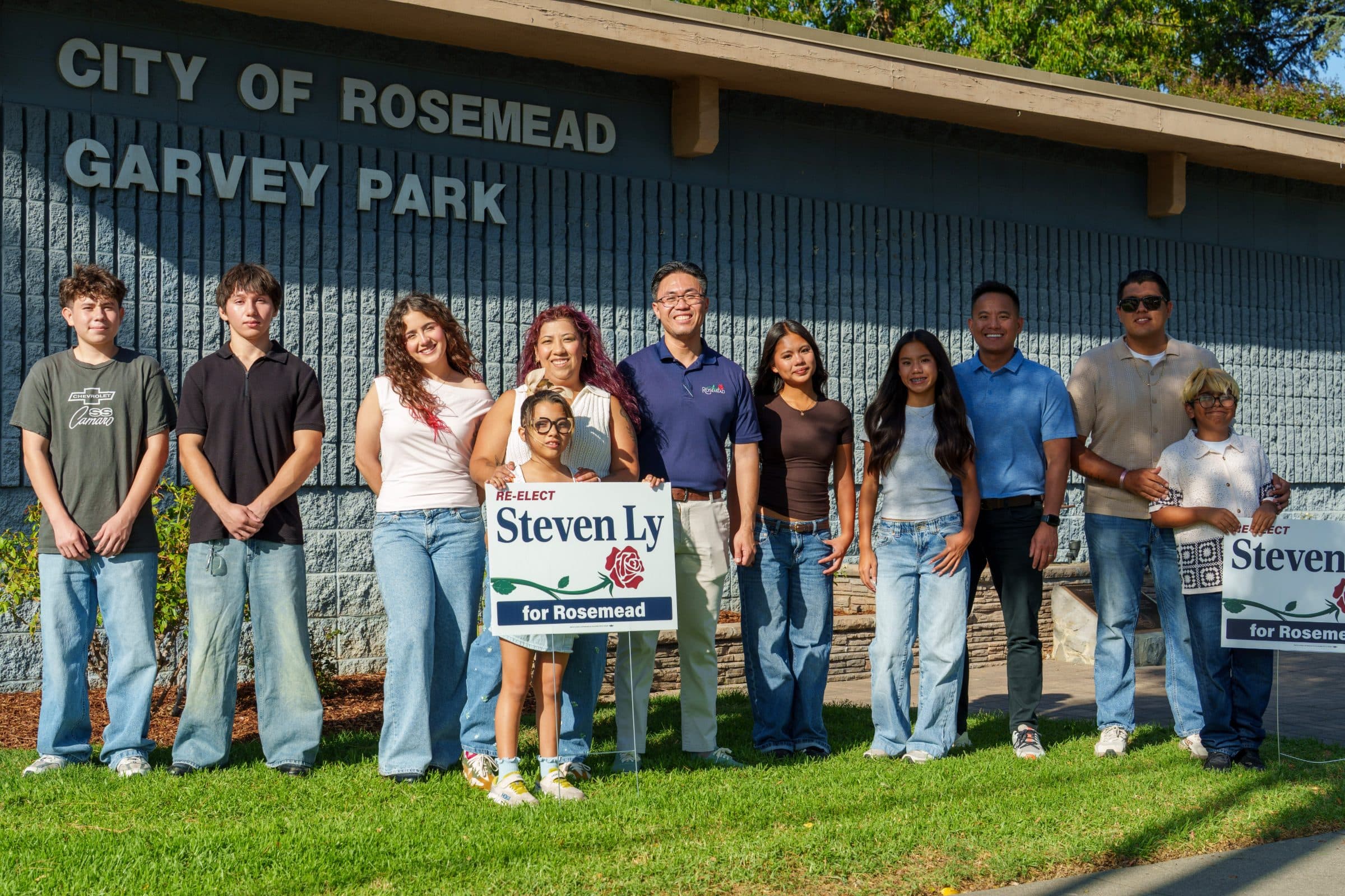 Steven Ly with supporters and campaign signs at Garvey Park